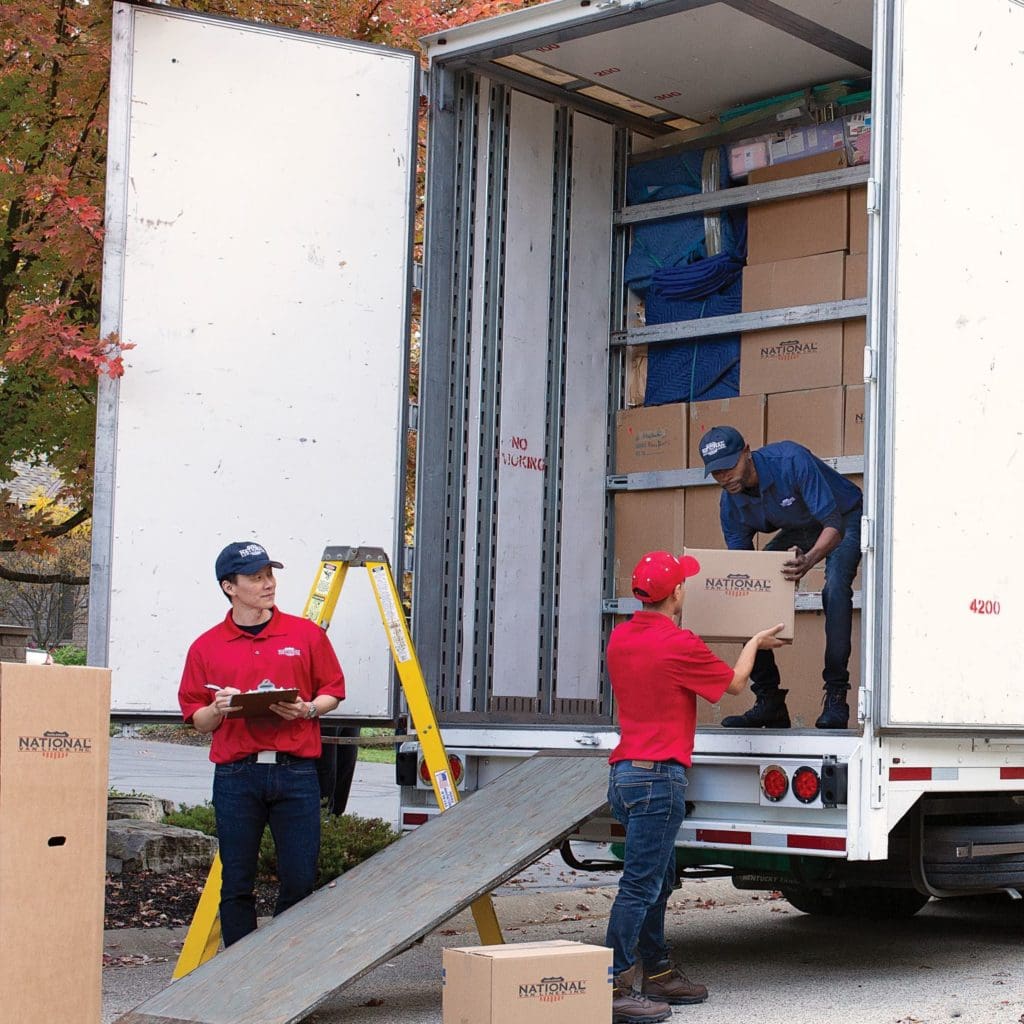 National Van Lines moving crew unloading the moving truck